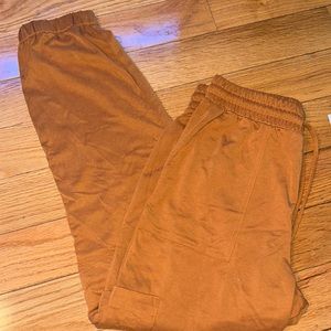 Orange color athletic joggers that is size xs from loft